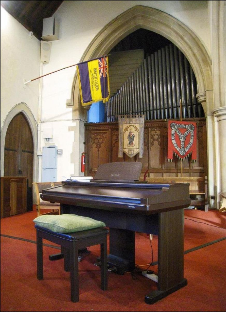 This digital piano was bought by the church in the 1990's for use as an alternative to the organ when the church found itself without a regular organist. In the background some of the pipes of the 'Father Willis' organ can be seen. The organ has been installed in the church since the beginning of the last century.