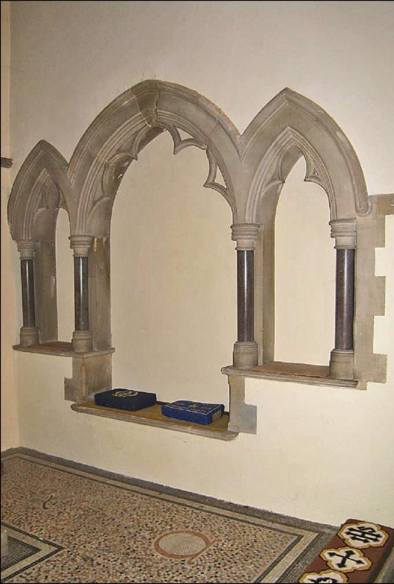 The triple sedilia in Holy Trinity church (a set of three canopied stone seats, on the south wall of the chancel, for use by clergy during services).