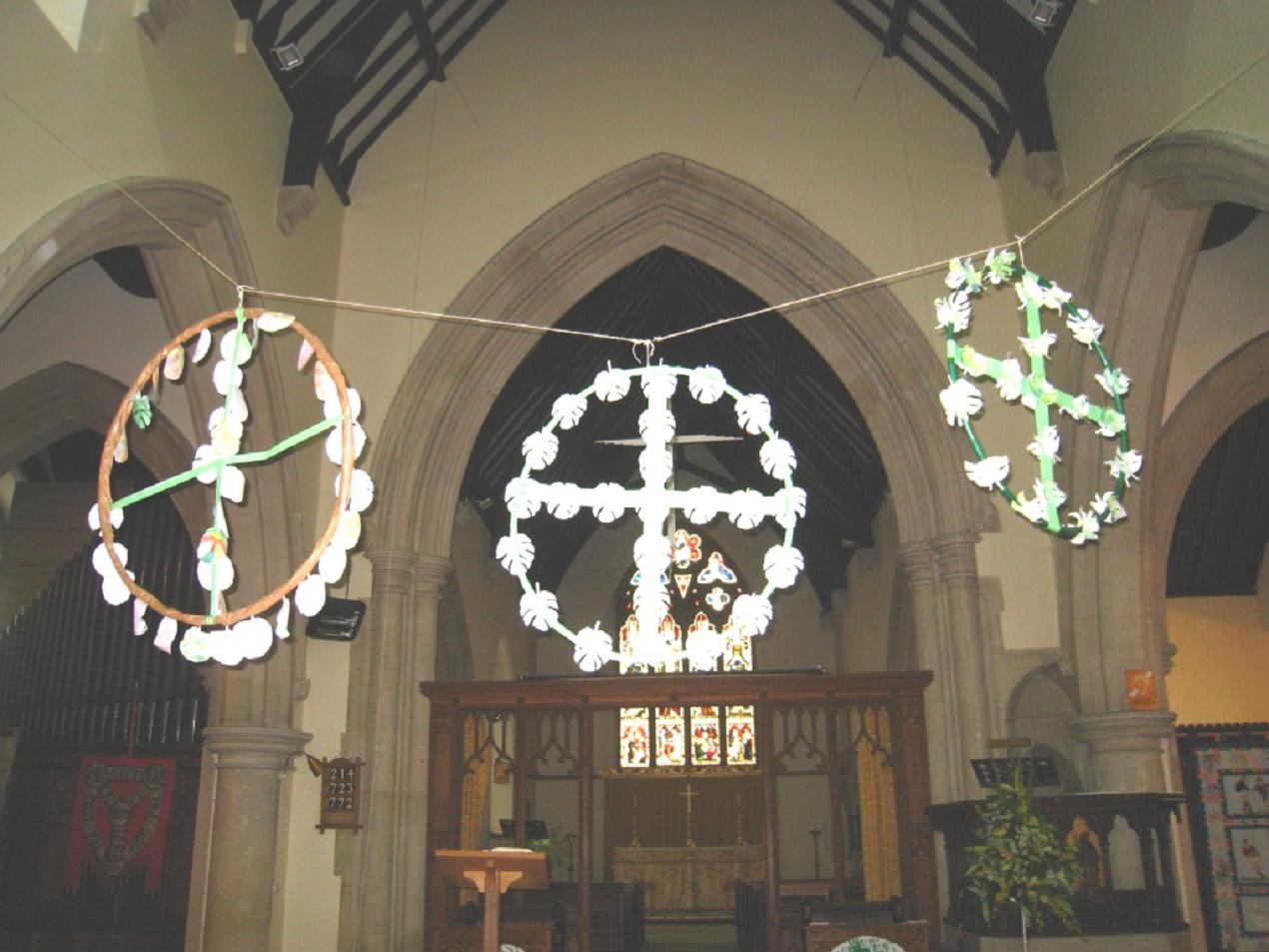 Glowing paper chandeliers, made by children of Trinity Primary School, complement the Easter cheer at Holy Trinity church.