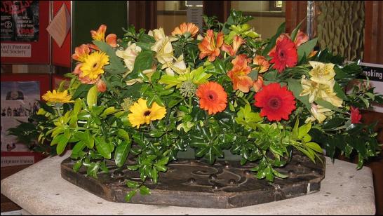 Harvest flowers decorate the font